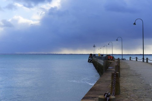 Hail showers in the vicinity #Cancale #bretagne . . #sea #seaside #harbor #harbour #jetty #headlight