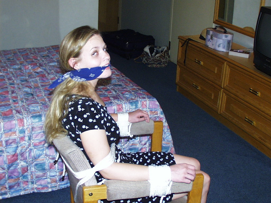 graybandanna:  Tied to a chair with a big blue bandanna gag 