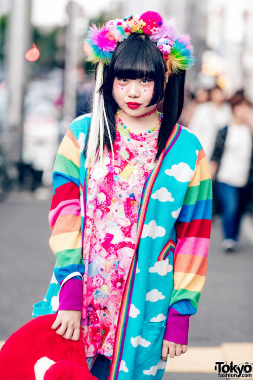 Japanese art student Chami on the street in Harajuku wearing a kawaii colorful look with a handmade 