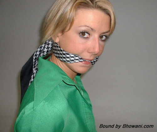 graybandanna:  Sabrina tied up in a green blouse with both a scarf cleave gag and a scarf over the nose gag