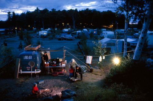 A family gathers near their campsite at dusk near Georgian Bay, Ontario, July 1963.Photograph by Win