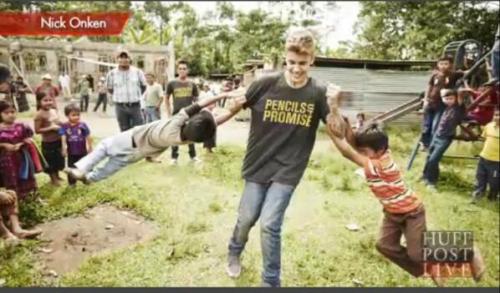 abovetheabundance:  Photographic evidence of Justin throwing small minority children and smiling about it. 