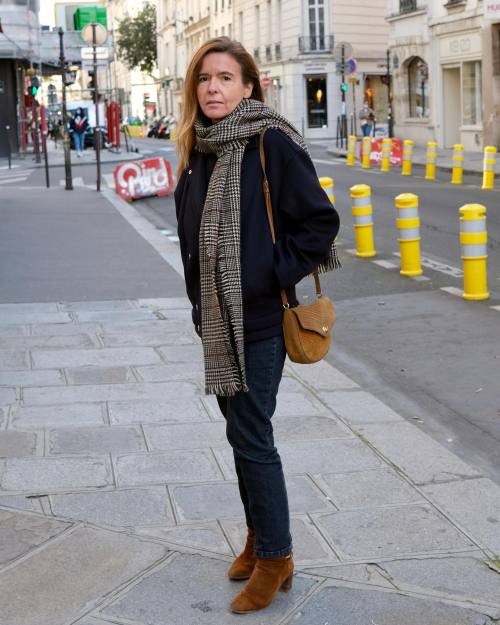 Marie Anne, spotted in Le Marais, Paris. Wearing a navy blazer, black jeans, a plaid scarf, and brow