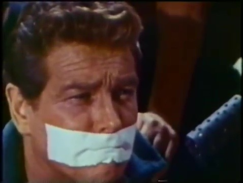 Man on the Spying Trapeze (1966) part 2 of 2Spy Jerry Land (Wayde Preston) gets an onscreen tapegagg