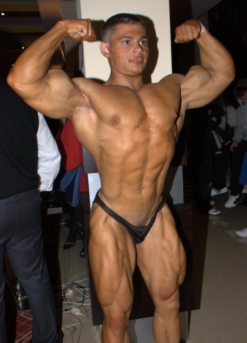 Another View Of Alexey In His Loose Fitting Posing Trunks. Once Again It Looks As If There Is Nothing