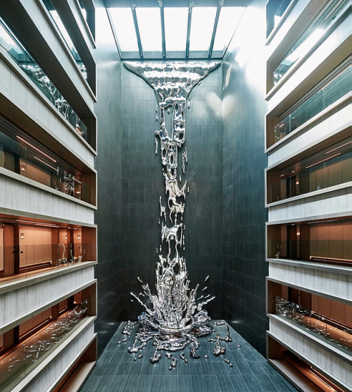 itscolossal:A Multi-Story Metallic Splash by Pere Gifré Drops Through the Center of a Madrid Hotel