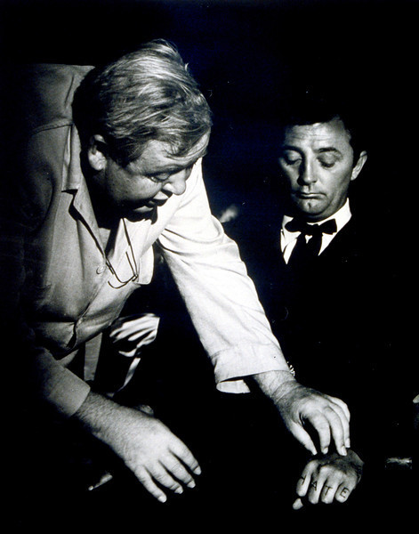 Charles Laughton directs Robert Mitchum on the set of NIGHT OF THE HUNTER (1955). (photo credit: United Artists/MGM)