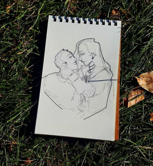 cryke-art: [Image Description: a photo of a tiny sketchbook laid out on the grass. there is a drawin