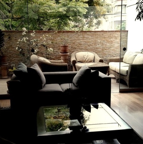 Home Bar Living RoomA Large, Eclectic, Open-concept Living Room With A Bar And White Walls Is Shown In