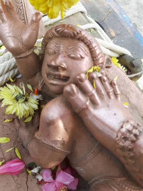 Apasmara ( ignorance and epilepsy) under Shiva feet