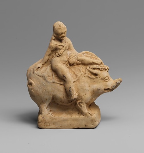 ancientpeoples:Terracotta statuette of Eros riding a boar  11.1cm high (4 3/8 inch.)  Greek cultur