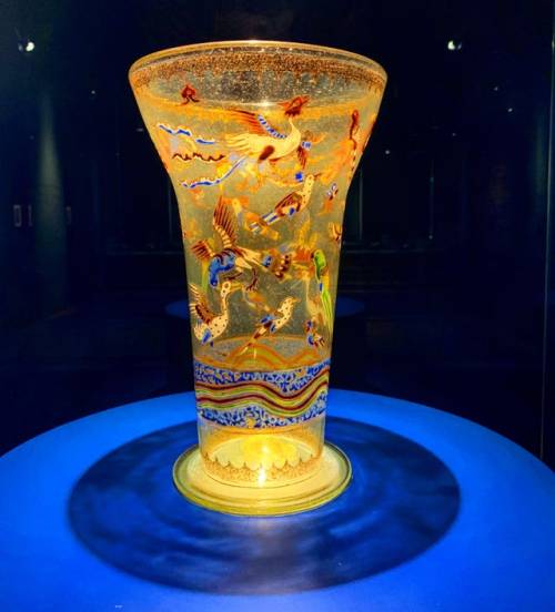A Mamluk enamelled and gilded glass beaker decorated with mythical and real birds. Made in Egypt or 