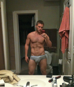 homopower:  Built hunk in his grey briefs!  Love it!   Looks like he sports a sizeable pair on him too