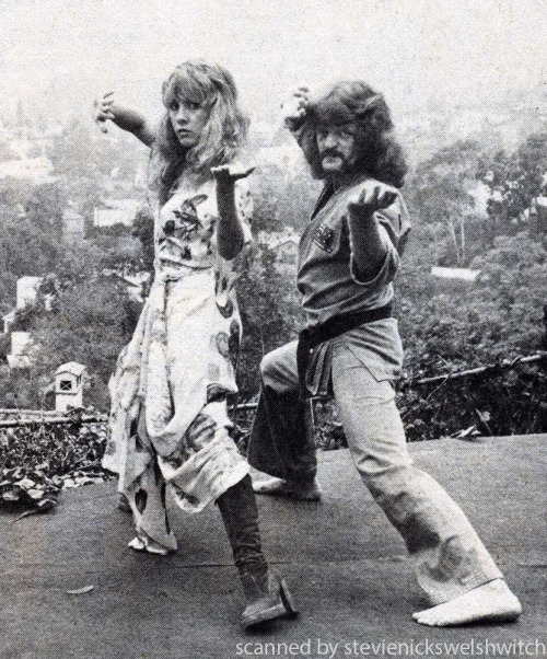 Stevie practicing some karate moves in her backyard with her bodyguard Bob Jones - 1977.