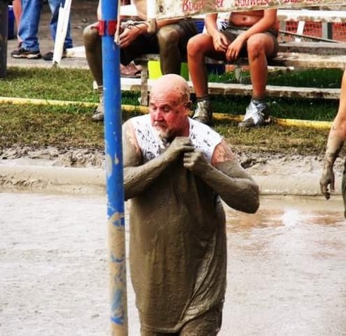 I like it when an older guy is not afraid to get muddy. And in a white t-shirt to boot!