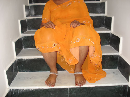 iloveindianwomen:  Desi Maid in Yellow Saree Loves to Show Her Cunt. For Full sets go here and here   The last pic is another up-saree pic