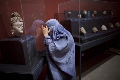 Afghan woman checking out the Mes Aynak exhibit at the National Museum in Kabul.