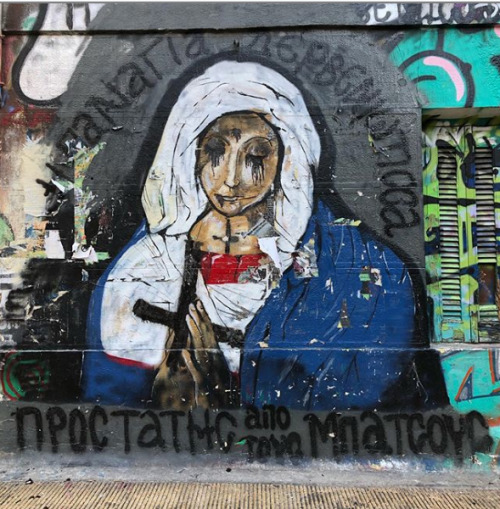 “Virgin Mary the squatter - Protector from the cops" Seen in Exarcheia, Athens, Greece