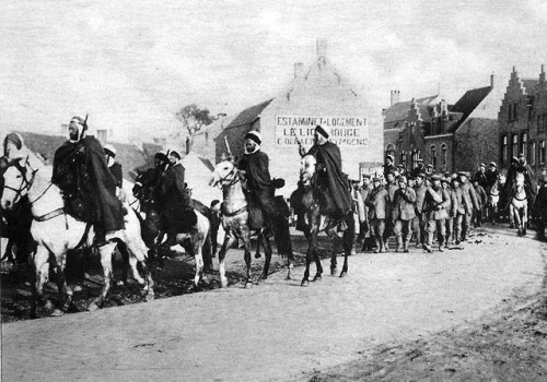 Algerian cavalry attached to the French army escort a group of German POWs, taken during fighting in