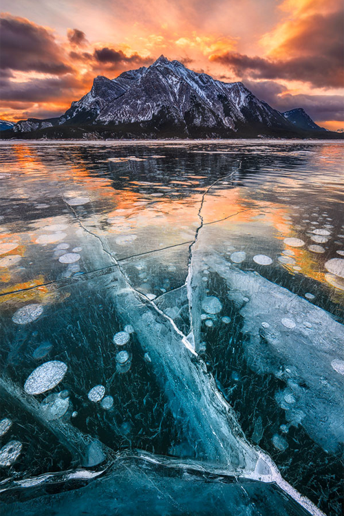 Thundered Ice ~ By Artur Stanisz Abraham Lake in Canadian Rockies is famous for ice bubbles and othe