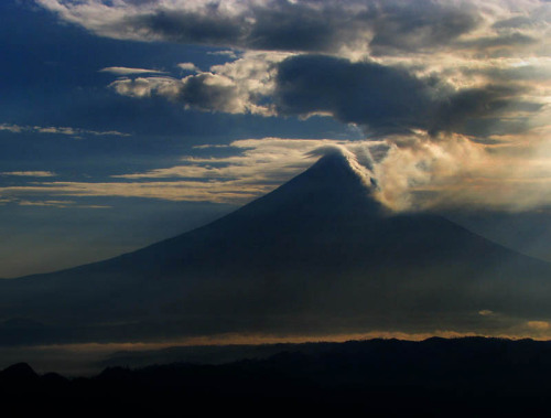 Shadowy coneThe shape of Mount Mayon in the Philippines is distinctive enough that you can recognize