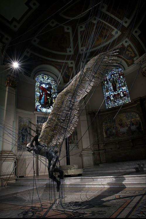 unexplained-events:  Lucifer (Morningstar) A wax sculpture depicting the devil snared in a set of power lines built by Paul Fryer. The sculpture is illuminated by the church’s stained glass windows. It can be seen at The Holy Trinity Church in Marylebone,