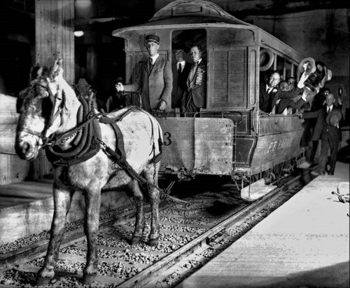 Nov. 30, 1925: An old horse-drawn car makes a trip during grand opening ceremonies for the higher-te