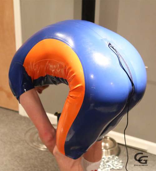 chicagogear:  @kinkyboinick, (Shinymarc) looking amazing in his blue and orange surfsuit.   Had a great time strapping him to the table for some electro fun!   Note there is also a cable going into his rear zip! (zap!)