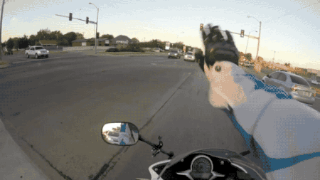 gifsboom:  Video: Motorcyclist saves kitten on intersection 