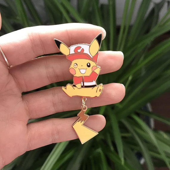 retrogamingblog:  Pokemon Let’s Go Pikachu and Eevee Dangling Tail Pins made by