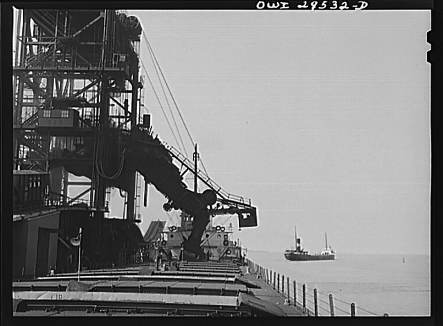 “Sandusky, Ohio. Loading coal from the Pennsylvania Railroad docks into a lake freighter. In the distance, a boat that has just been loaded is leaving port.”Jack Delano, 1943. (minor processing by R. Jake Wood, 2022).Library of Congress Prints & Photographs Online CatalogFarms Security Administration/Office of War Information Collection. #photography #library of congress #FSA/OWI#jack delano