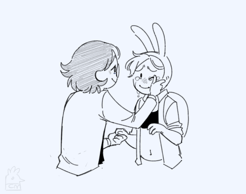 Simon and Fionna biding each other farewell, he holds her right hand while wipping a tear off her left eye. Both of them are smiling to each other