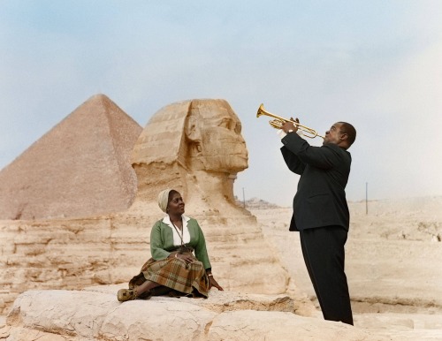 earthshaker1217:serafino-finasero:Louis Armstrong serenading his wife, Lucille Wilson, in front of t