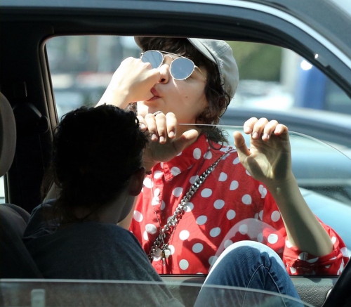 fiftyshadesdarker:Kristen Stewart’s girlfriend Soko licking her fingers in a parking lot in Lo