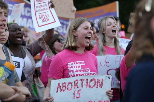From The Fight for Roe, one of 25 photos. Agnes Scott College student Jordan Simi (center) participa