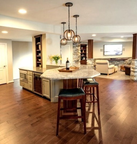 Basement - Traditional BasementLarge Elegant Basement Image With White Walls, A Stone Fireplace In The