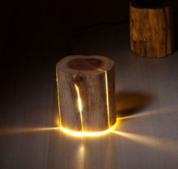 odditymall:    The stump light is a cracked log that can be used as a table or a stool that has lights built into it that show through the cracks in the log.http://odditymall.com/stump-light-cracked-log-lamp
