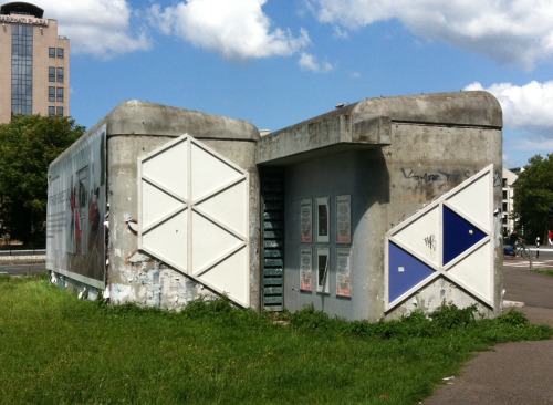 Beautiful concrete structure mercilessly defaced with coloured plates, Amsterdam-Oost