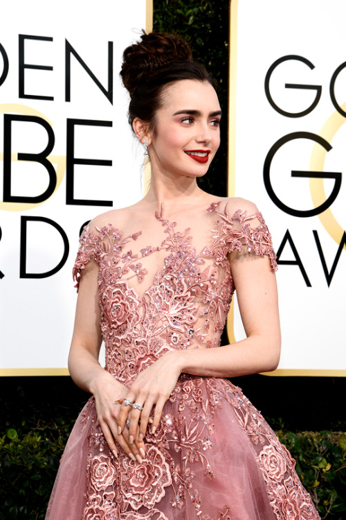 dylanobrien:Lily Collins arrives to the 74th Annual Golden Globe Awards held at the Beverly Hilton H