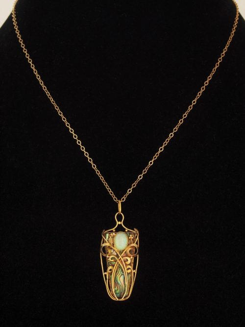 cair–paravel:Art Nouveau gold and abalone pendant with an opal (via).