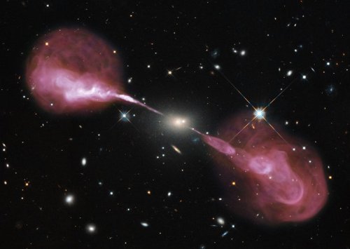 cosmicvastness: A supermassive black hole in action The yellow-hued object at the centre of the fram