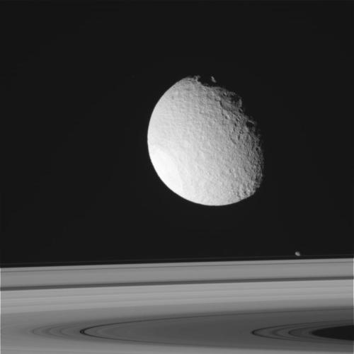 Tethys above Saturn’s moon, taken by Cassini.  
