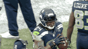 peterfromtexas:  Marshawn Lynch threw the ball into the crowd after scoring his 3rd