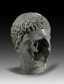 archaicwonder:  Vandalized Roman Bronze Portrait Head of Geta(?), 3rd Century AD A life size bronze portrait of a bearded young man in the style and iconography of the Severan princes Geta and Caracalla. Obviously it has been vandalized, damaged with