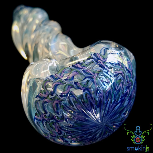 Synthesis Glass. Thick. Looks like a jelly fish to me :) I love these pipes, I’ve dropped them, and 