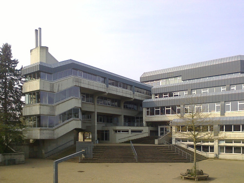 sosbrutalism:One of the few terraced school buildings at the time of construction and now. Concrete 