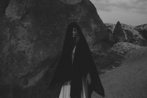 The Witch’s Kingdom - a photostory shot by Noisenest, model and narrative Theresa Manchester″All Hallow’s Eve - the sun retreats over the hillside. A faint glimmer of soft, cool light remains in the valley.  A cloaked figure emerges from a