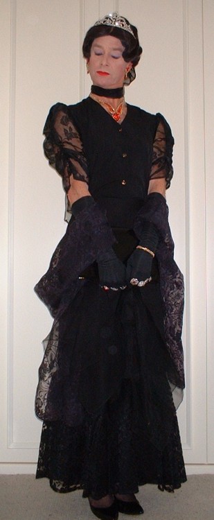 Long flounced evening skirt with chiffon sleeved blouse, chiffon scarves and wrap, patent black clut