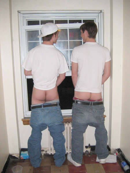 Bros taking a piss out the window