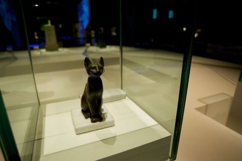 Statuette of Bastet A bronze figure of Bastet, goddess of war and fertility, as a seated cat is disp